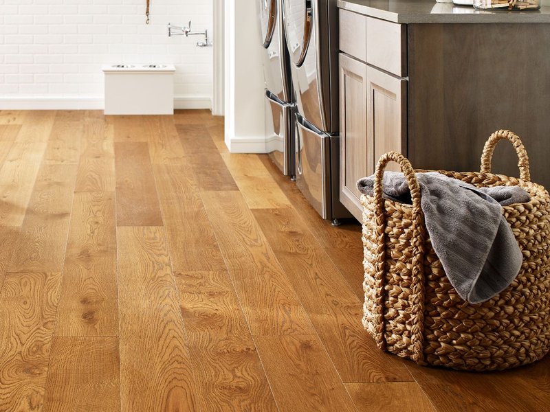 Basket laundry on a brown hardwood from Potomac Tile and Carpet in Frederick, MD